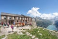 Olpererhutte, Austria - Aug 7, 2020: Tourists take photo of glacier at view point