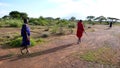 Traditional Masai tribesmen in the savannah of Tanzania in west Africa
