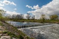 Olse river with small weir and tress in Karvina city in Czech republic Royalty Free Stock Photo