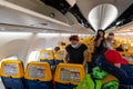 13/09/2021. Olsztyn-Mazury Airport, Poland. Ryanair airplane ready for departure. Passengers taking allocated seats in the cabin.