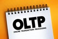 OLTP - Online Transaction Processing acronym text on notepad, abbreviation concept background