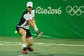 Olympic champion Andy Murray of Great Britain in action during men`s doubles first round match of the Rio 2016 Olympic Games Royalty Free Stock Photo