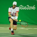 Olympic champion Andy Murray of Great Britain in action during men`s doubles first round match of the Rio 2016 Olympic Games Royalty Free Stock Photo