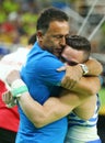 Olympic champion Eleftherios Petrounias of Greece R with his coach after Men`s Rings Final on artistic gymnastics competition