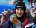 Olympic champion in Ladies` Moguls Perrine Laffont of France posing with gold medal Royalty Free Stock Photo