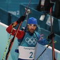 Olympic champion Martin Fourcade of France celebrates victory in biathlon men`s 15km mass start at the 2018 Winter Olympics