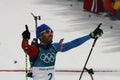 Olympic champion Martin Fourcade of France celebrates victory in biathlon men`s 15km mass start at the 2018 Winter Olympics