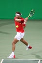 Olympic champion Rafael Nadal of Spain in action during men`s doubles round 3 of the Rio 2016 Olympic Games Royalty Free Stock Photo