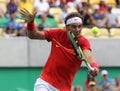 Olympic champion Rafael Nadal of Spain in action during men`s singles semifinal match of the Rio 2016 Olympic Games Royalty Free Stock Photo