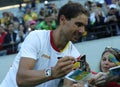 Olympic champion Rafael Nadal of Spain gives autographs after men`s singles semifinal of the Rio 2016 Olympic Games Royalty Free Stock Photo