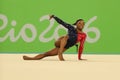 Olympic champion Simone Biles of USA competes on the floor exercise during women's all-around gymnastics qualification Royalty Free Stock Photo