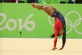 Olympic champion Simone Biles of USA competes on the floor exercise during women's all-around gymnastics qualification Royalty Free Stock Photo