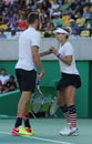 Olympic champions Jack Sock (L) and Bethanie Mattek-Sands of United States in action during mixed doubles final of the Rio 2016