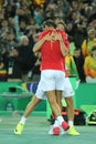 Olympic champions Rafael Nadal and Mark Lopez of Spain celebrate victory at men's doubles final of the Rio 2016 Olympics