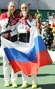 Olympic champions team Russia Ekaterina Makarova (L) and Elena Vesnina during medal ceremony after tennis doubles final