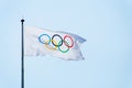 Olympic flag, blue sky background