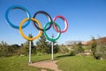 The Olympic Games symbol in a park.