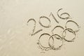 Olympic Rings 2016 Message Drawn in Sand Royalty Free Stock Photo