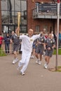 Olympic Torchbearer Paul Giblin with the torch Royalty Free Stock Photo