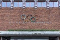 Olympisch Stadion Amsterdam. Olympic rings on red brown bricks.