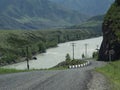 Mountain road with cliffs along the Katun River Royalty Free Stock Photo