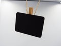 blackboard hanging with brown yarn in the air