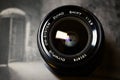 Olympus OM Shift lens 35mm F2.8 on a photography book