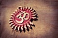 Om pendent on wood background and greeting