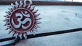 Om pendent on wood background and greeting