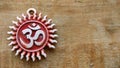 Om pendent on wood background and greeting