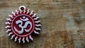 Om pendent on wood background and greeting