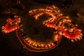 Om Spiritual Sign Illuminated With Candles