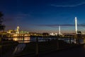 Omaha Nebraska downtown skyline at dusk. Bob Kerrey foot bridge over Missouri river.