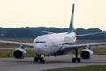 Oman Air taxiing on runway, close-up view Royalty Free Stock Photo