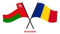 Oman and Romania Flags Crossed And Waving Flat Style. Official Proportion. Correct Colors