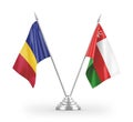 Oman and Romania table flags isolated on white 3D rendering