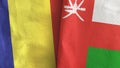 Oman and Romania two flags textile cloth 3D rendering