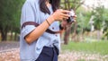 WOman`s hands holding an camera at nature background Royalty Free Stock Photo