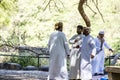 Oman Salalah - Local arab people talking during Jeep Tour at Wadi Derbat Sultanate green oasis 17.10.2016.