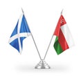 Oman and Scotland table flags isolated on white 3D rendering