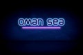 Oman Sea - blue neon announcement signboard