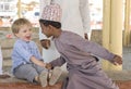 Omani boy making frineds with european boy