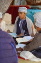 Muslim arab boy reading Quran