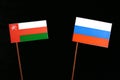 Omani flag with Russian flag on black