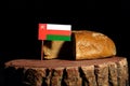 Omani flag on a stump with bread