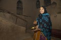 Omani lady with sandalwood paste on her forehead