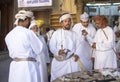 Omani man buying a sword