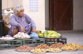 Omani man selling new season dates at a street market in Nizwa