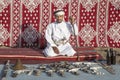 Omani man selling traditional khanjar daggers Royalty Free Stock Photo