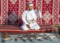 Omani man selling traditional khanjar daggers